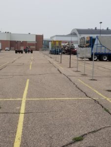 A shot of temporary fencing being installed by American Fence Company in the parking lot at the famous Nebraska State Fair