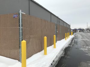 Privacy slats installed in a commercial chain link fence in Sioux City, IA