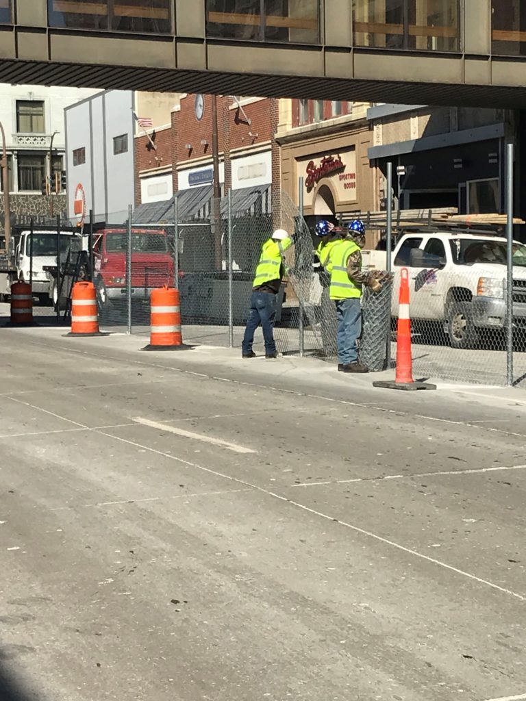 Sioux City installation crews putting in 8' tall temporary construction fence