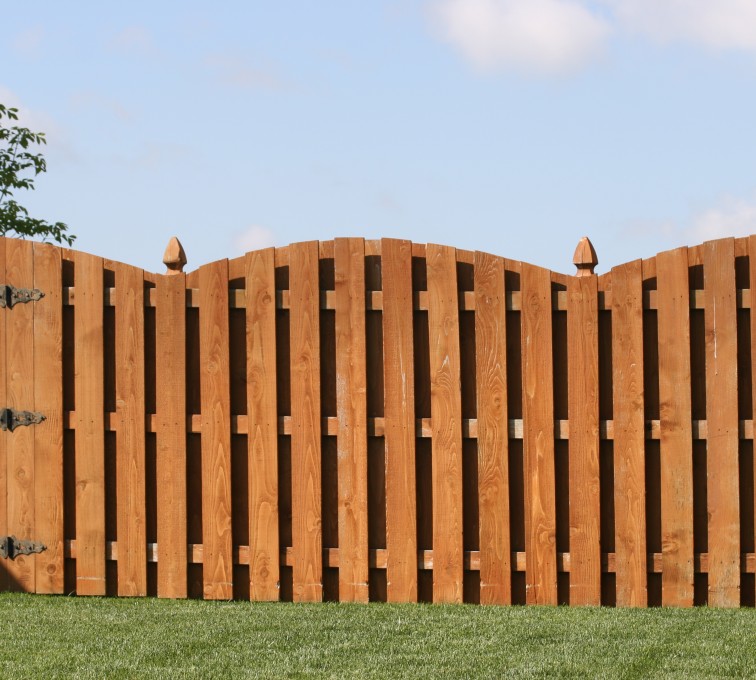 The American Fence Company - Wood Fencing, 1010 6' board on board overscallop stained
