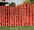 The American Fence Company - Wood Fencing, 1014 6' overscallop board on board stained 4