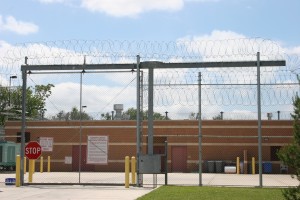 High security sliding gate with barb wire installed on top