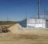 Ballistic fencing surrounding an electric facility from bullets and projectiles