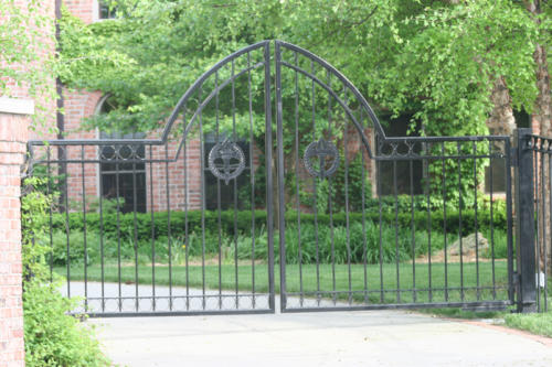 6-10 foot black iron ornamental double swing gate with steep overscallop