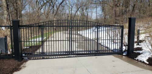 6-8 foot tall black automated gate