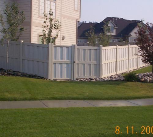 6-8 foot tall shadow-boxed vinyl fencing with an exterior horizontal plank in the middle connecting fencepost to fencepost
