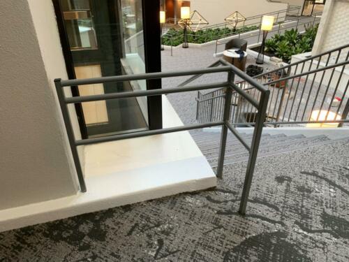 3 - 4 foot tall gray metal handrails for short ramp -close up