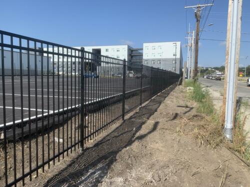 4 foot black ornamental fence surrounding parking lot