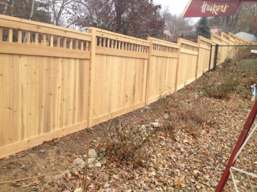 4-6 foot tall privacy picket fence with custom 2-5 inch vertical gaps that run horizontally across the top