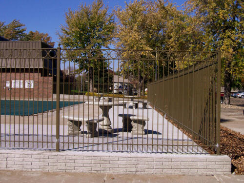 6 - 8 foot tall custom ornamental fence enclosing pool