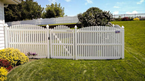 4-6 foot white vinyl picketed fence with an over-scalloped cut